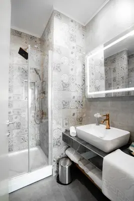 a white bathroom with a sink and a shower at Homey AirPort Hotel in Arnavutköy