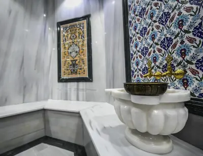 a bathroom with a large white vase on a table at Dedeman Kartepe Kocaeli in Kocaeli