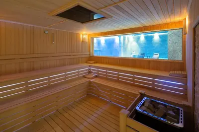an inside view of a sauna with a large window at Dedeman Kartepe Kocaeli in Kocaeli