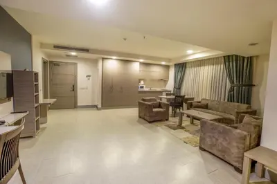 a living room with a couch and chairs and a table at Sen Otel in Sakarya