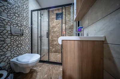 a bathroom with a toilet and a shower at LAOS OTEL in Istanbul