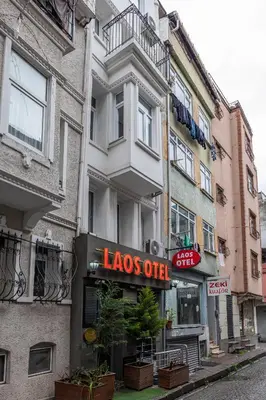 a building with a sign for a lobos outlet at LAOS OTEL in Istanbul