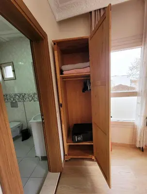 a closet with a door open in a bathroom at Masif House in Istanbul