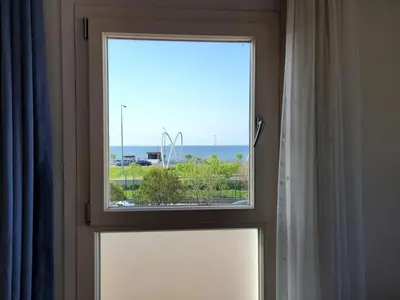 a window in a room with a view of the ocean at Masif House in Istanbul