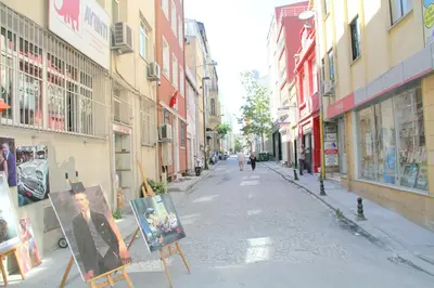 an empty street with paintings on easels in a city at Istanbul Central Hotel in Istanbul