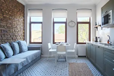 a living room with a couch and a table at Sunflower Apartments in Istanbul