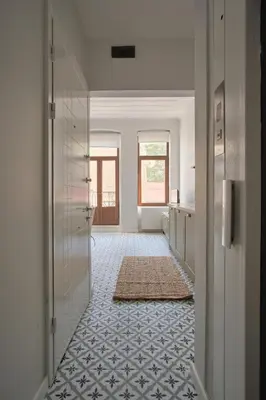 a bathroom with a hallway with a tile floor at Sunflower Apartments in Istanbul