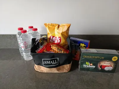 a bag of snacks and water bottles on a counter at Luxury Duplex with Terrace Apartment by Siena Suites in Istanbul