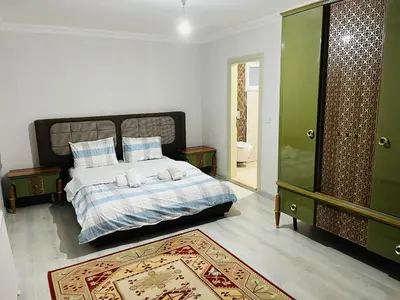 a bedroom with a bed with two towels on it at Sapanca Manzara Villa 2 Isıtma Havuzlu in Sapanca