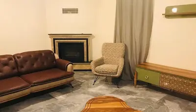 a living room with a couch and a chair at Sapanca Manzara Villa 2 Isıtma Havuzlu in Sapanca