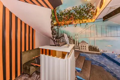 a staircase in a building with a painting on the wall at La Pera Suites Hotel in Istanbul
