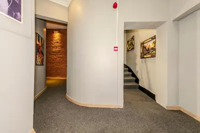 a hallway with a white column in a building at La Pera Suites Hotel in Istanbul