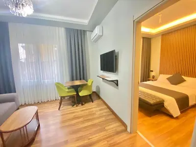 a hotel room with a bed and a table at sahar sultan hotel in Istanbul