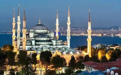 a large building with blue domes and mosques at sahar sultan hotel in Istanbul