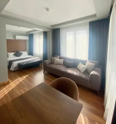 a living room with a couch and a bed at sahar sultan hotel in Istanbul