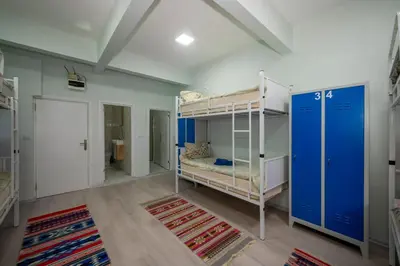 a room with two bunk beds and a hallway at XALİLA HOSTEL & CAFE LADİES ROOM in Istanbul