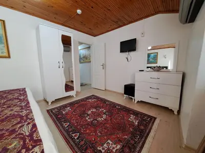 a bedroom with a bed and a dresser and a mirror at Golden Life GL in Istanbul