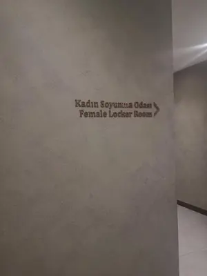 a sign on a wall in a room at My G yoo Apartment #1 in Istanbul
