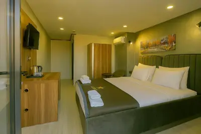 a bedroom with a large bed with white pillows at Monezza Avcılar in Istanbul