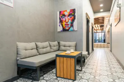 a living room with a couch and a painting on the wall at Monezza Avcılar in Istanbul