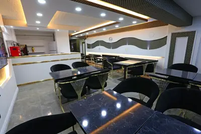 a dining room with black tables and chairs at Nişantaşı Diamond Hotel in Istanbul