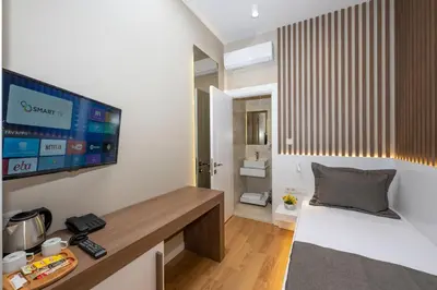 a room with a tv on a wall at Hotel Grand İstanbul in Istanbul