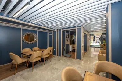 a dining room with blue walls and a table and chairs at Hotel Grand İstanbul in Istanbul
