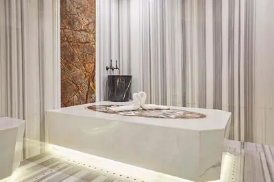 a bath tub with a towel on top of it at THE HUBİ HOTEL in Istanbul