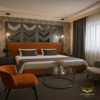 a bedroom with a large bed and a glass table at Valeron Suit Premium in Istanbul