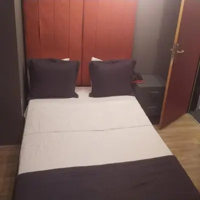 a bedroom with a large bed with two pillows at Valeron Suit Premium in Istanbul