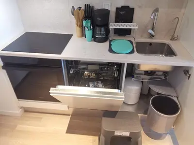 a kitchen counter with a sink and a dishwasher at My G yoo Apartment #2 in Istanbul