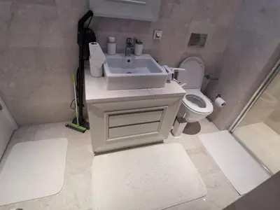 a bathroom with a sink and a toilet at My G yoo Apartment #2 in Istanbul