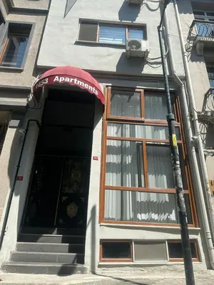 an entrance to a building with a red awning at 1453Apartments in Istanbul