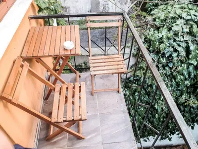 a table and a chair on a balcony at 1453Apartments in Istanbul