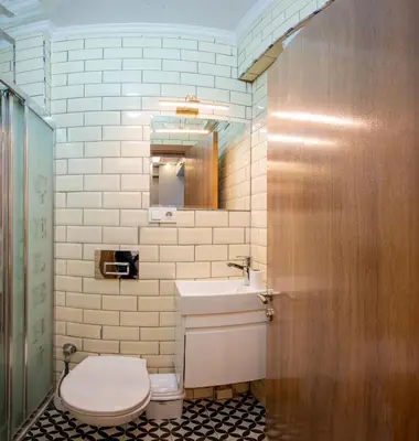 a bathroom with a toilet and a sink at Taksim Story Residence in Istanbul