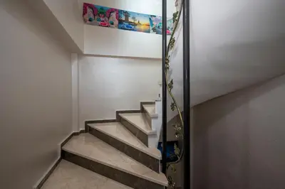 a set of stairs with a painting on the wall at Taksim Story Residence in Istanbul