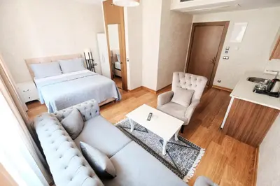 a living room with a couch and a bed at İstanbul Houses Sabiha Gökçen Airport in Istanbul