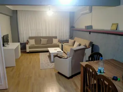 a living room with a couch and a table at 2 bedrooms central area located appartment 1floor in Istanbul