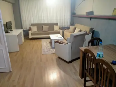 a living room with a couch and a table at 2 bedrooms central area located appartment 1floor in Istanbul