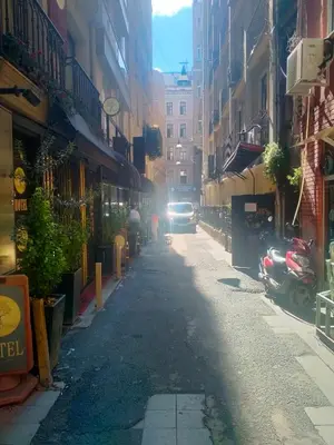 a car driving down a city street with buildings at 2 bedrooms central area located appartment 1floor in Istanbul