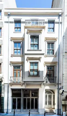 a large white building with windows and balconies at Art Pera Suites in Istanbul