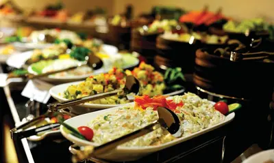 a buffet with plates of food on a table at Tuyap Palas in Istanbul