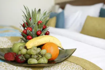 a bowl of fruit on a plate on a table at Tuyap Palas in Istanbul
