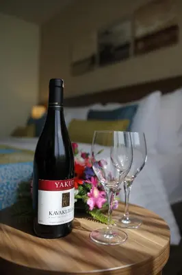 a bottle of wine and two glasses on a table at Tuyap Palas in Istanbul