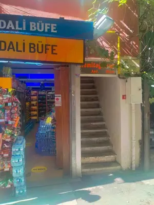 a store with a staircase leading up to a mall at 2 bedrooms central area located appartment 2 floor in Istanbul