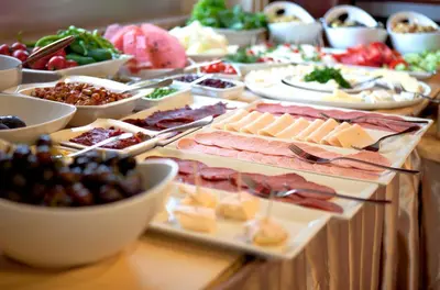 a buffet of cheese and meats and other foods on a table at Sefa Hotel 2 Çorlu in Corlu