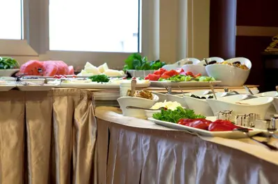 a buffet with several plates of food on a table at Sefa Hotel 2 Çorlu in Corlu