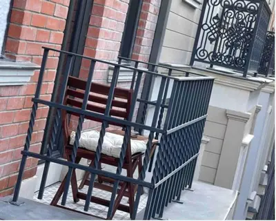 a wooden chair sitting on the side of a building at Taksim 360 Luxe Apartment Prime Istanbul Location in Istanbul