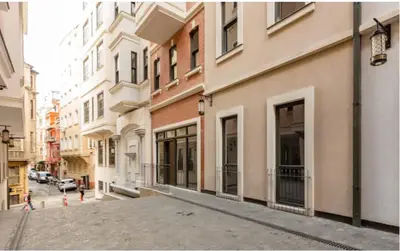 an empty street in a city with buildings at Taksim 360 Luxe Apartment Prime Istanbul Location in Istanbul