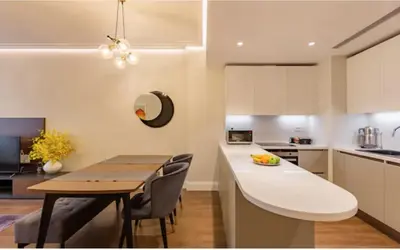 a kitchen and dining room with a table and chairs at Taksim 360 Luxe Apartment Prime Istanbul Location in Istanbul